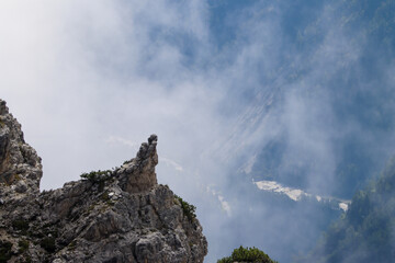 Ethereal alpine spires fading into misty skies