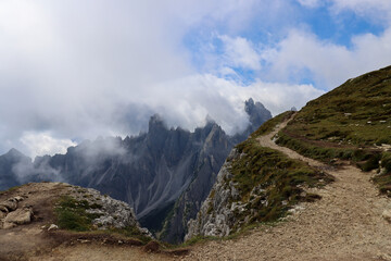 Alpine trail leading to Cadini di Misurina under dramatic skies