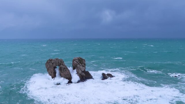 Storm and waves at "Urro del Manzano," also known as "Gateway to the Cantabrian Sea." Cantabrian Sea. Liencres Natural Park in the Costa Quebrada Geopark. Liencres, Cantabria, Spain, Europe