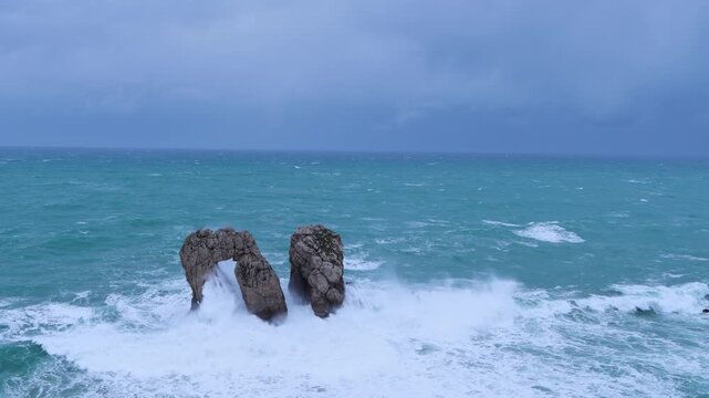 Storm and waves at "Urro del Manzano," also known as "Gateway to the Cantabrian Sea." Cantabrian Sea. Liencres Natural Park in the Costa Quebrada Geopark. Liencres, Cantabria, Spain, Europe