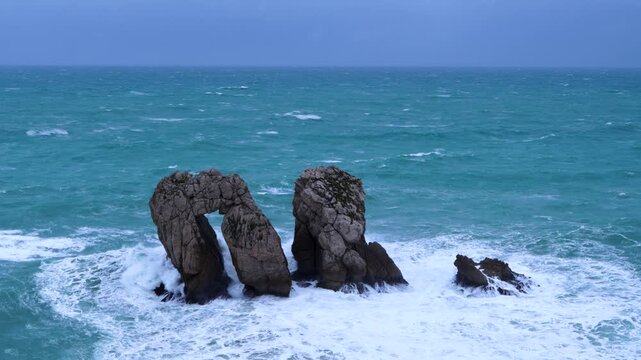 Storm and waves at "Urro del Manzano," also known as "Gateway to the Cantabrian Sea." Cantabrian Sea. Liencres Natural Park in the Costa Quebrada Geopark. Liencres, Cantabria, Spain, Europe
