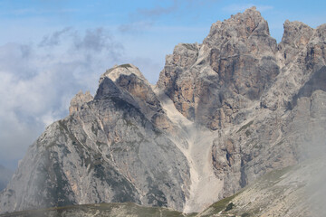 Cadini di Misurina Dolomites peaks rising through drifting clouds