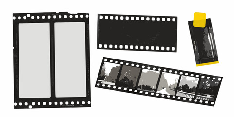 Vintage film strips and a film canister isolated on a white background