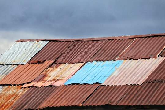 Old metal sheet roof texture. Pattern of old metal sheet. Rusty tin texture