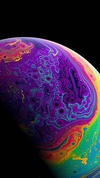 Rainbow Colored Soap Bubble on Black Background.