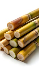 Fresh sugar cane stalks cut and stacked together