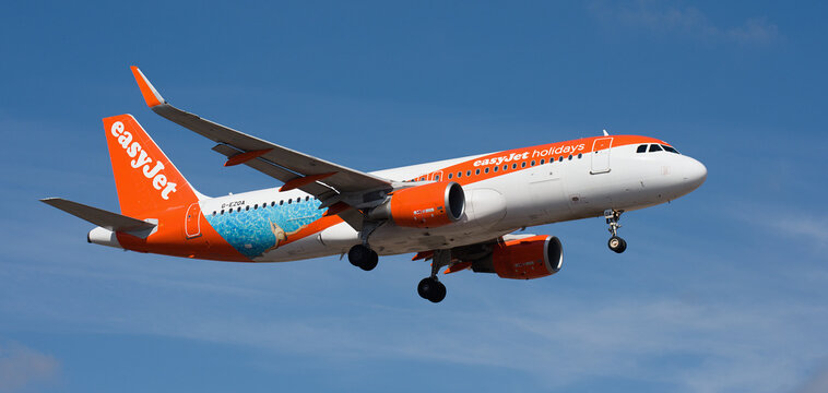 Tenerife, Spain january 30st, 2026. Airbus A320-214 easyJet (easyJet Holidays Livery) Airlines flies in the blue sky. Landing at Tenerife Airport