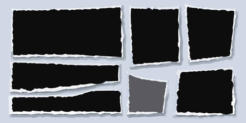 Collection of torn paper pieces on a light gray background