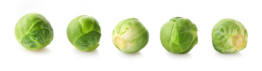 Set of fresh green Brussels sprouts on white background