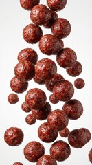 Falling meatballs isolated on white background, group of flying roasted meat balls in motion, food levitation and cooking concept