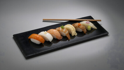 Assorted Sushi Set on Black Slate with Chopsticks