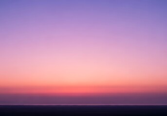 Vibrant Gradient Sky at Twilight Horizon with Pink and Purple Hues