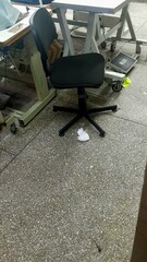 Industrial Office Chair Inside a Sewing Workshop and Industrial Work Environment