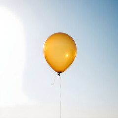 Obraz premium Yellow Gold Balloon Floating in Blue Sky for Hope Freedom Celebration Air 