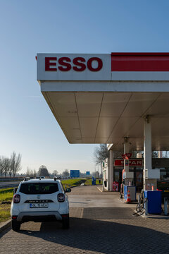 January 24, 2026, Middelburg, Netherlands - White Dacia Duster car parked at an Esso gas station with a SPAR store