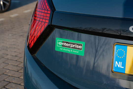 January 24, 2026, Amsterdam, Netherlands - Close-up of an Enterprise car sharing and rental sticker on the rear of a car with a Dutch license plate