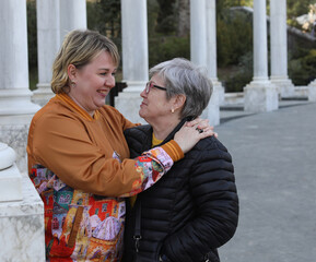 Fototapeta premium Portrait of a adult daughter and senior mother, care, support and relationsheep between generations