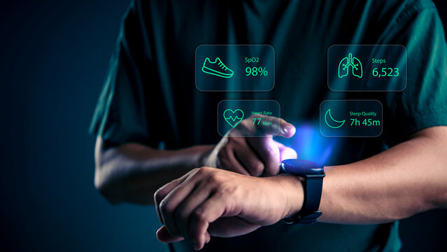Man using smartwatch with holographic interface showing heart rate SpO2 and steps data. Futuristic wearable technology concept for digital health monitoring and fitness tracking analysis.