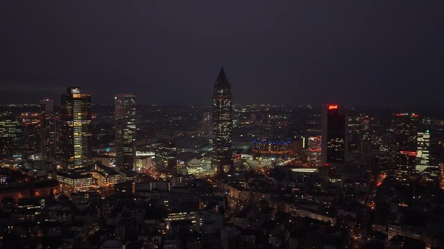 Aerial night view of illuminated Frankfurt am Main skyline. City's financial district with modern skyscrapers in Germany's main banking hub