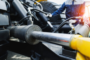 Hydraulic equipment in mining industry with engineer operating machinery