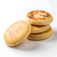 golden brown pancakes stacked on top of each other on white background