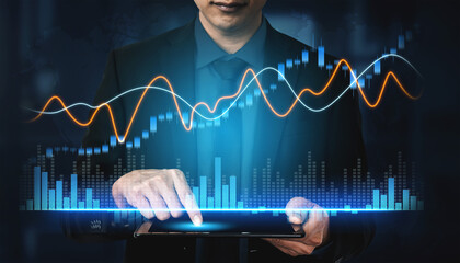 A business professional engaged in analyzing live data on a tablet, with dynamic statistical...