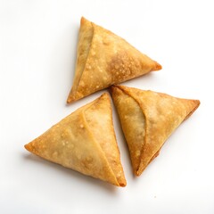 golden brown samosas arranged on a white background