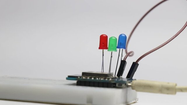 Red, green and blue or RGB led blinking that is connected and controlled by a programmable micro controller