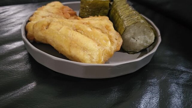 apple pie on a plate,,Indonesian called Lemang or Lamang is Minang kabau ,West Sumatra traditional food,made from glutinous rice,coconut milk ,popular for breakfast,served with fried banana