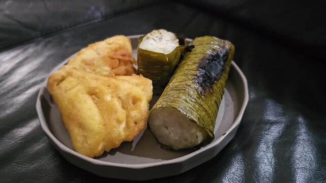 apple pie on a plate,,Indonesian called Lemang or Lamang is Minang kabau ,West Sumatra traditional food,made from glutinous rice,coconut milk ,popular for breakfast,served with fried banana