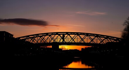 Fototapeta premium Silhouette of bridge at sunset landscape.