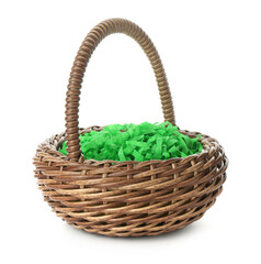 Obraz premium Wicker Easter basket with green shredded paper filling isolated on white