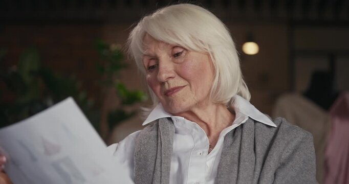 A devoted artist engages with her craft, surrounded by tools and soft light, her joy clearly visible