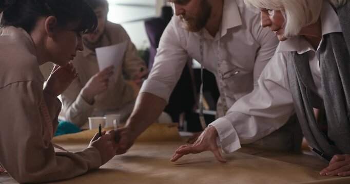 Participants enthusiastically collaborate in a lively workshop, exchanging ideas and creating designs together