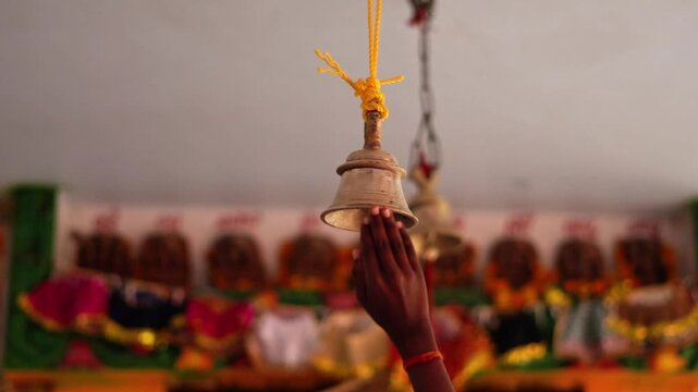 Traditional hindu temple bell cinematic view. Devotional Hindu Ritual Inside Temple. Ringing Bell in a Hindu Temple.