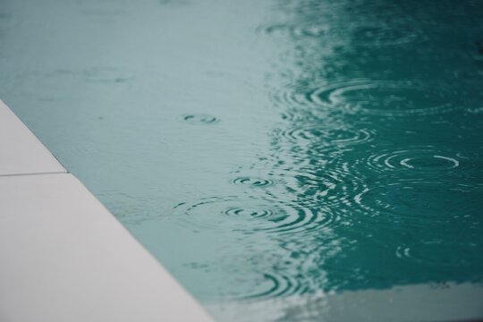 Abstract Water Ripples Rain Falling on Calm Pool Surface Teal Blue Minimalist Texture