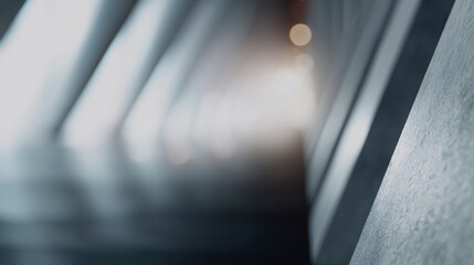 Long, narrow hallway with a wall of grey concrete
