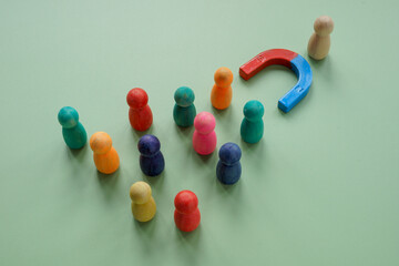 Audience figures and magnet as concept of customer attraction and lead generation.
