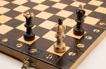 Chess checkmate position with king and queen on wooden board, symbolizing victory, strategy, leadership and final decision. Concept of business success, dominance and winning move.