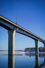 Beautiful winter lake landscape with bridge. Bridge over the lake Saimaa. Vekaransalmi bridge at winter.