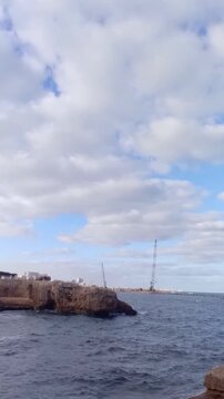 A great view of some rocks, the Mediterranean Sea and the sky is next to Masoud Well in Sidi Bishr, Alexandria, Egypt. The view is in the morning. Masoud Well may be an ancient Greek tomb.