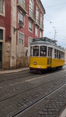Naklejka premium Yellow Lisbon Tram on street