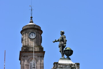 Tower of Palacio da Bolsa with statue from Monument  to prince Henri the Navigator in foreground. Location: Porto Portugal