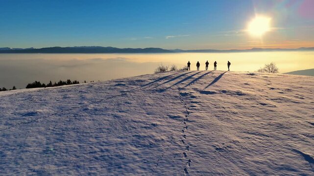 Aerial drone shot. People on top of hill, hikers enjoys beautiful view point. Outdoor activity, exercise, sport, hiking. Fresh air. 