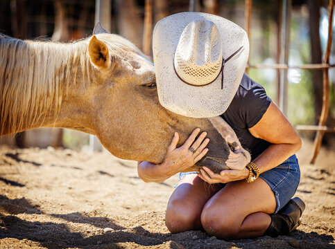 Cowgirl and Horse Hug