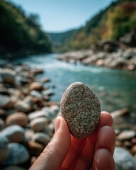Digital detox routine closeup of a smooth river stone tranquil riverbank nature photography serene environment personal reflection