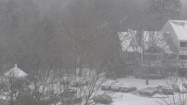 Winter Storm Gianna in Greenville, South Carolina. Strong Snow Blizzard in Winter, Greenville, South Carolina. Blizzard Strong Wind And Heavy Snow Lash Town. Heavy Snowstorm in Residential Area.