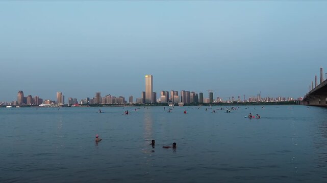 Stunning day to night timelapse of Nanchang city skyline showing urban lights traffic flow and modern city life in China.