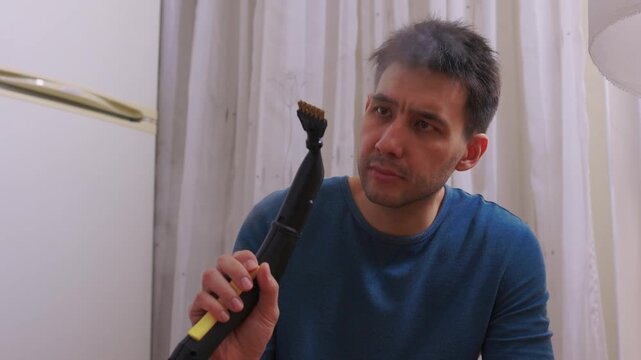 Floor cleaning detail. Technician delicately removing dirt from shiny floor grout lines. Modern apartment floor restoration with precise nozzle and softening vapor techniques