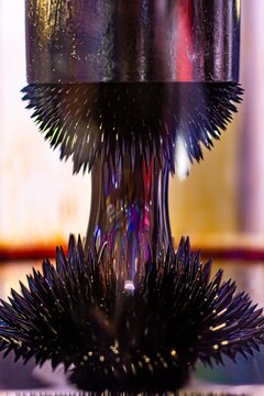 Ferrofluid spikes forming between magnets during science experiment closeup